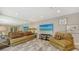Comfortable living area with neutral colors, wall mirror and recessed lighting at 3842 Glen Oaks Manor Dr, Sarasota, FL 34232