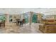 Bright and airy living space featuring tile floors, and direct access to the outdoors at 3842 Glen Oaks Manor Dr, Sarasota, FL 34232