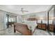 This is the main bedroom with refined decor and access to an outdoor seating area at 3842 Glen Oaks Manor Dr, Sarasota, FL 34232