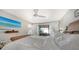 Comfortable main bedroom includes a TV, neutral decor, and access to the outdoor area at 3842 Glen Oaks Manor Dr, Sarasota, FL 34232