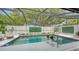 Screened pool area features a sparkling pool, lounge chair, and decorative plants at 3842 Glen Oaks Manor Dr, Sarasota, FL 34232