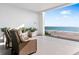 This cozy balcony features comfortable seating and a stunning view of the ocean at 4765 Gulf Of Mexico Dr # B202, Longboat Key, FL 34228