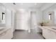 Modern bathroom with double sinks, granite countertops, ample storage, and neutral color palette at 4765 Gulf Of Mexico Dr # B202, Longboat Key, FL 34228