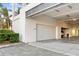 Spacious garage with high ceilings, a modern door, and ample parking space at 4765 Gulf Of Mexico Dr # B202, Longboat Key, FL 34228