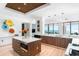 Bright and airy kitchen featuring a large island, stainless appliances, and views of the water at 4765 Gulf Of Mexico Dr # B202, Longboat Key, FL 34228