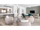 Contemporary living room with an open layout, featuring modern furnishings and an adjacent kitchen area at 4765 Gulf Of Mexico Dr # B202, Longboat Key, FL 34228