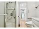 Bathroom featuring a shower and toilet with white cabinetry at 4803 Brae Burn Ave, Sarasota, FL 34234