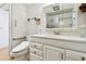 Bathroom vanity with wood-style flooring and a toilet at 4803 Brae Burn Ave, Sarasota, FL 34234
