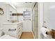 Bathroom featuring a shower and a sink with a cabinet with drawers and knobs at 4803 Brae Burn Ave, Sarasota, FL 34234