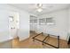 Bedroom featuring mirrored closet doors, hardwood floors and ceiling fan at 4803 Brae Burn Ave, Sarasota, FL 34234