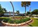 Well-maintained clubhouse with brick walkway and mature trees at 4803 Brae Burn Ave, Sarasota, FL 34234