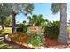 Community entrance sign with well-maintained landscaping and mature trees at 4803 Brae Burn Ave, Sarasota, FL 34234