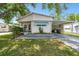 Charming single-story home featuring a covered carport and well-maintained landscaping, perfect for comfortable living at 4803 Brae Burn Ave, Sarasota, FL 34234