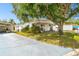Inviting single-story residence with a large tree-shaded yard and extended driveway, offering ample outdoor space at 4803 Brae Burn Ave, Sarasota, FL 34234