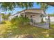 Delightful home featuring a covered entry and manicured lawn, creating a welcoming and serene curb appeal at 4803 Brae Burn Ave, Sarasota, FL 34234