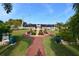 Community entrance with manicured landscaping and paved walkway at 4803 Brae Burn Ave, Sarasota, FL 34234