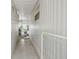 Hallway shows durable flooring, modern fixtures, and provides access to the porch at 4803 Brae Burn Ave, Sarasota, FL 34234