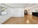 Open living room featuring hardwood floors and a bright window at 4803 Brae Burn Ave, Sarasota, FL 34234