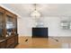 Open-concept living room features wood flooring and vintage-style furnishings at 4803 Brae Burn Ave, Sarasota, FL 34234