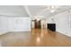 Open-concept living room features wood flooring and vintage-style furnishings at 4803 Brae Burn Ave, Sarasota, FL 34234