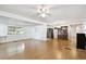 A living room featuring hardwood floors and a ceiling fan at 4803 Brae Burn Ave, Sarasota, FL 34234