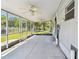 Spacious patio with durable flooring, bright lighting, and access to the backyard at 4803 Brae Burn Ave, Sarasota, FL 34234