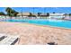 Large, inviting pool with lounge chairs and a tiki hut, perfect for relaxation and outdoor fun at 4803 Brae Burn Ave, Sarasota, FL 34234