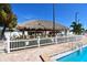 Relaxing tiki bar with poolside seating, ideal for enjoying refreshments in a tropical setting at 4803 Brae Burn Ave, Sarasota, FL 34234