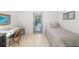 A tidy bedroom with a desk and a bed and door to outside at 494 Sapphire Dr, Sarasota, FL 34234
