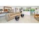 Bright living room featuring modern decor, an open layout, and seamless flow to the kitchen area at 494 Sapphire Dr, Sarasota, FL 34234