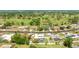 Lovely aerial view of the backyard pool and landscaping in a desirable neighborhood with a golf course at 504 Whitfield Ave, Sarasota, FL 34243