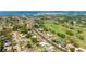 Aerial view showcases a home near a golf course, offering scenic views and a community-oriented lifestyle at 504 Whitfield Ave, Sarasota, FL 34243