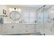 A renovated bathroom with a modern vanity, marble shower, and beautiful fixtures shows luxury and thoughtful design at 504 Whitfield Ave, Sarasota, FL 34243