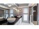 Modern bathroom with dual vessel sinks, sleek black countertops, tiled walls and a glass-enclosed shower at 504 Whitfield Ave, Sarasota, FL 34243