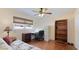 Cozy spare bedroom with a futon, desk, hardwood floors and built-in shelving would make an excellent home office at 504 Whitfield Ave, Sarasota, FL 34243