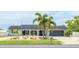 Beautiful home with a welcoming entrance, lush landscaping, and a well-kept facade at 504 Whitfield Ave, Sarasota, FL 34243