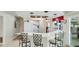 Bright kitchen features a breakfast bar with seating, modern appliances, and direct access to the outdoors at 504 Whitfield Ave, Sarasota, FL 34243