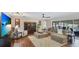 Cozy living room with plush seating, hardwood floors, and an entertainment center at 504 Whitfield Ave, Sarasota, FL 34243