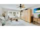 Bright and airy living room with stylish furniture, window, and ample storage space at 504 Whitfield Ave, Sarasota, FL 34243