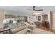 Open concept living area showcasing a sectional sofa and access to the outdoor patio and pool at 504 Whitfield Ave, Sarasota, FL 34243