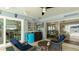 Outdoor living area with seating, access to the kitchen, and views of the home's interior at 504 Whitfield Ave, Sarasota, FL 34243