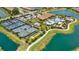 An aerial view of a community clubhouse, pool, and recreational facilities, including tennis and bocce ball courts at 5313 Greenbrook Dr, Sarasota, FL 34238