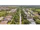 Expansive aerial view of a community with nature trails and tree-lined streets, offering serene living at 5313 Greenbrook Dr, Sarasota, FL 34238