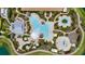 Breathtaking aerial view of the community's expansive pools, lush landscaping, and recreational facilities at 5313 Greenbrook Dr, Sarasota, FL 34238