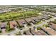 An aerial view of a neighborhood showcasing beautiful single-Gathering homes with mature landscaping at 5313 Greenbrook Dr, Sarasota, FL 34238