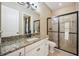 Bathroom with granite countertop and glass shower at 5313 Greenbrook Dr, Sarasota, FL 34238