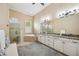 Spacious bathroom featuring a soaking tub, large shower, and double vanity sinks at 5313 Greenbrook Dr, Sarasota, FL 34238