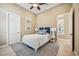 Well-lit bedroom with coastal decor, ceiling fan and neutral color palette at 5313 Greenbrook Dr, Sarasota, FL 34238