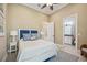 Comfortable bedroom with ensuite bathroom access and a soothing color palette at 5313 Greenbrook Dr, Sarasota, FL 34238