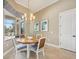 Light and airy dining area with view to the exterior at 5313 Greenbrook Dr, Sarasota, FL 34238